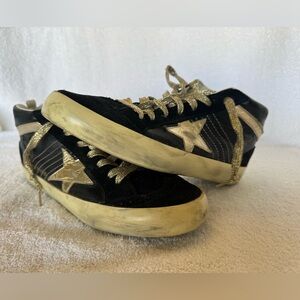 Golden Goose Black and Gold Sneakers.